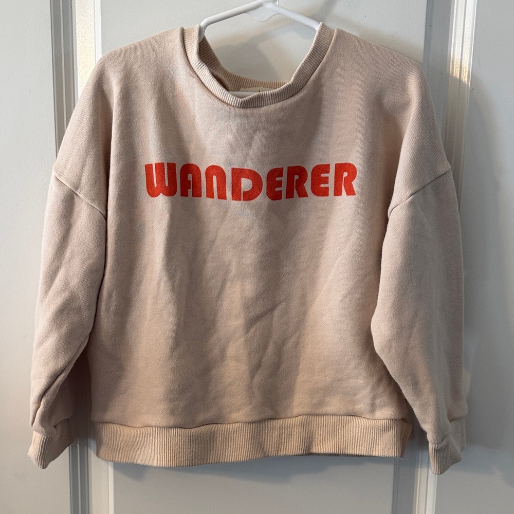 Wander & Wonder boutique Beige pullover with Vibrant orange Lettering
